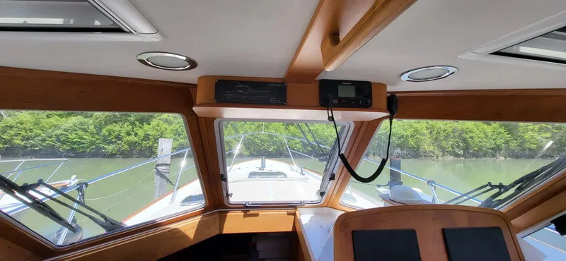  Yacht Photos Pics Interior view of 2022 Legacy 36 Legacy boat cockpit with river scenery.