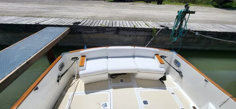  Yacht Photos Pics 2022 Legacy 36 boat with white seating at dockside.