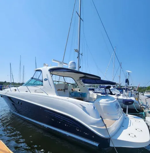  Yacht Photos Pics 2004 Sea Ray Sundancer 460 yacht docked in marina under clear blue sky.
