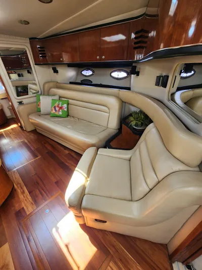  Yacht Photos Pics Luxurious 2004 Sea Ray Sundancer 460 yacht interior with leather seating and wooden flooring.
