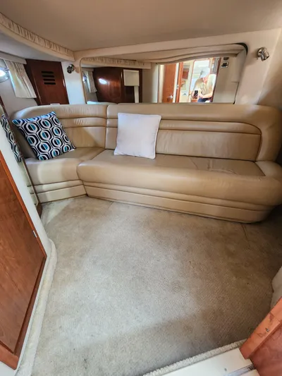  Yacht Photos Pics Interior of 2004 Sea Ray Sundancer 460 yacht with beige leather seating and decorative pillows.