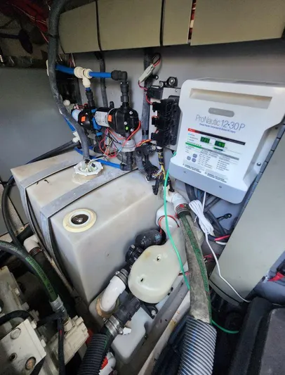  Yacht Photos Pics Engine room of 2004 Sea Ray Sundancer 460 with ProNautic charger and plumbing components.