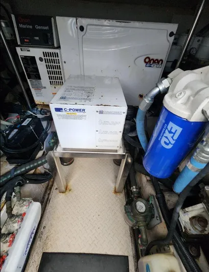  Yacht Photos Pics Engine room of 2004 Sea Ray Sundancer 460 with generator and filtration system.