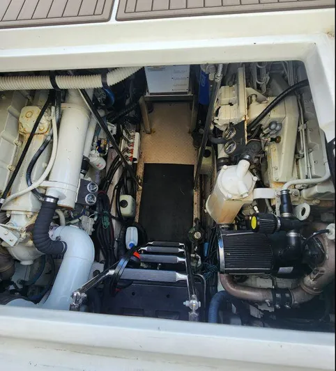  Yacht Photos Pics Engine compartment of a 2004 Sea Ray Sundancer 460 yacht, showcasing mechanical components.