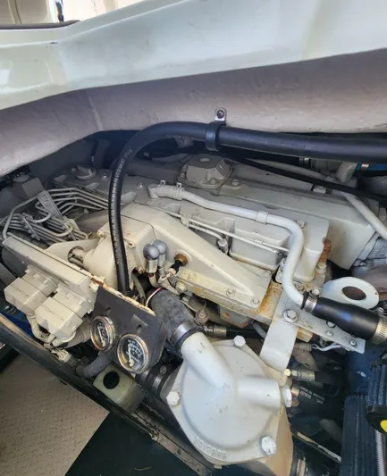  Yacht Photos Pics Engine compartment of a 2004 Sea Ray Sundancer 460 boat, showcasing mechanical components.