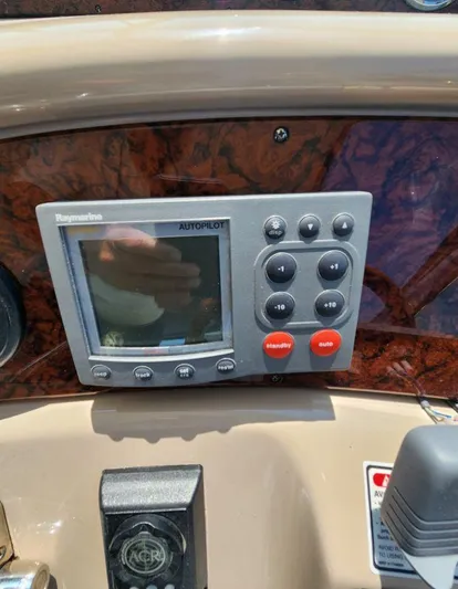 Yacht Photos Pics Raymarine autopilot control panel on 2004 Sea Ray Sundancer 460 yacht dashboard.