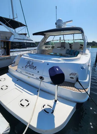  Yacht Photos Pics 2004 Sea Ray Sundancer 460 yacht docked, featuring spacious deck and elegant design.