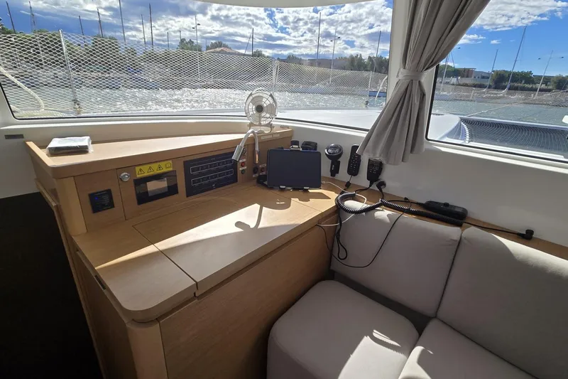  Yacht Photos Pics Interior of 2025 Excess 14 yacht with navigation equipment and comfortable seating.