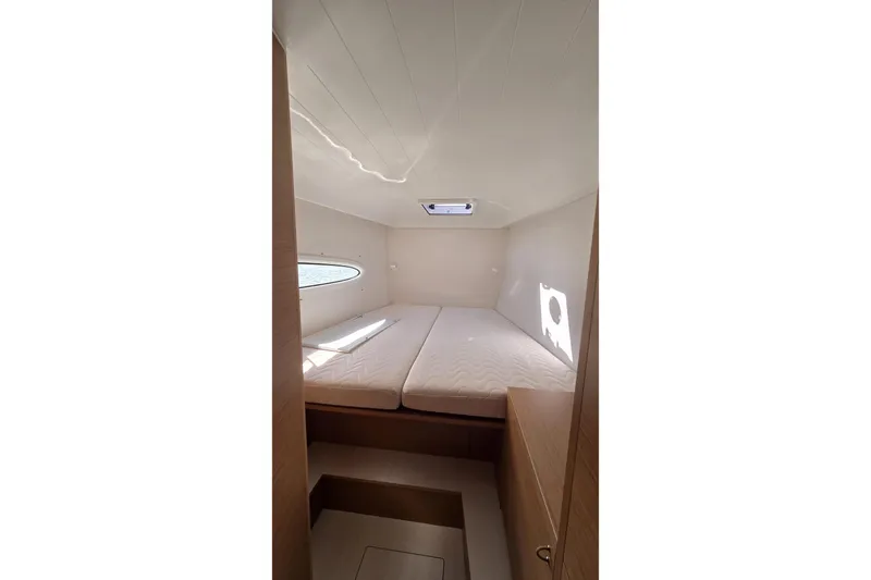  Yacht Photos Pics Interior cabin of 2025 Excess 14 yacht with twin beds and natural light.