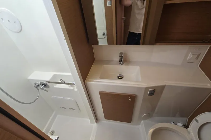  Yacht Photos Pics Compact bathroom in 2025 Excess 14 model, featuring sink, shower, and toilet.