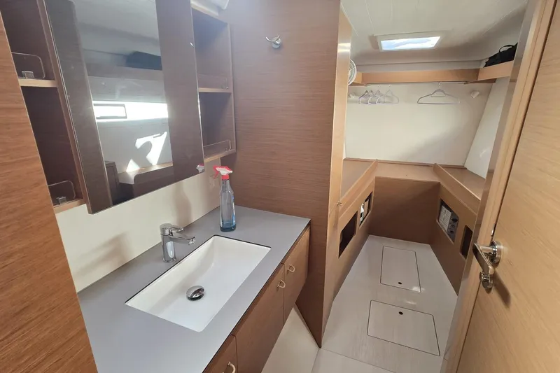  Yacht Photos Pics Modern bathroom and storage area in 2025 Excess 14 yacht, featuring sleek design and ample space.