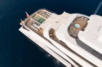 Luxurious 2022 Amels Custom yacht with pool and jacuzzi, aerial view.