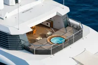 Luxurious 2022 Amels Custom yacht deck with jacuzzi and seating area.