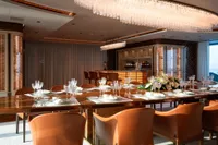 Luxurious dining area on 2022 Amels Custom yacht with elegant table setting and modern decor.