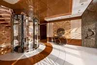 Luxurious interior of 2022 Amels Custom yacht with elegant wood and metal design elements.