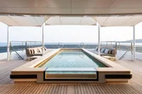 Luxurious Amels Custom 2022 yacht deck with pool and ocean view.