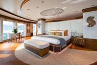 Luxurious 2022 Amels Custom yacht bedroom with elegant decor and stunning ocean views.