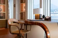 Luxurious interior of 2022 Amels Custom yacht with elegant desk and chair.