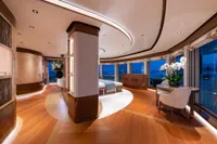 Luxurious interior of 2022 Amels Custom yacht with elegant wood flooring and modern decor.