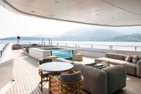 Luxurious 2022 Amels Custom yacht deck with pool, seating, and scenic ocean view.