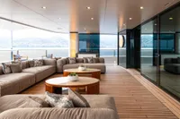 Luxurious 2022 Amels Custom yacht deck with elegant seating and ocean view.