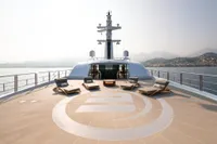 Luxurious 2022 Amels Custom yacht deck with sun loungers and scenic ocean view.