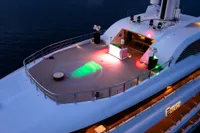 Luxurious 2022 Amels Custom yacht deck with vibrant lighting and modern design.