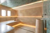 Luxurious Amels Custom 2022 yacht interior with elegant marble and ambient lighting.