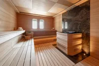 Luxurious sauna interior on 2022 Amels Custom yacht, featuring wood paneling and elegant design.