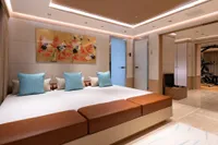 Luxurious 2022 Amels Custom yacht interior with modern decor and elegant artwork.