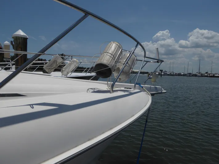 Bee Cee Yacht Photos Pics 2000 Silverton 42C Cummins yacht docked at marina under clear blue sky.