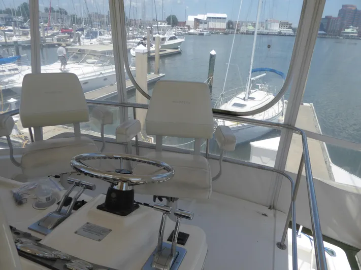 Bee Cee Yacht Photos Pics Helm of 2000 Silverton 42C yacht with marina view.