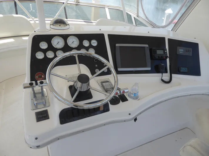 Bee Cee Yacht Photos Pics Helm of 2000 Silverton 42C Cummins 450 Diesels with steering wheel and gauges.