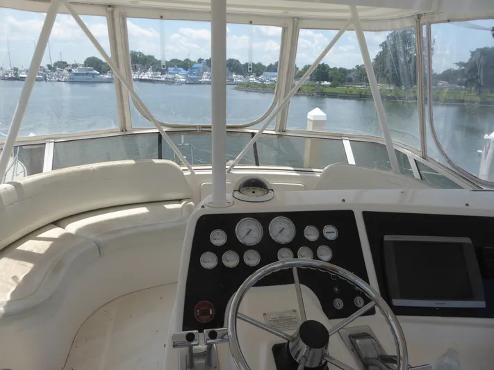 Bee Cee Yacht Photos Pics Helm of 2000 Silverton 42C yacht with Cummins 450 Diesels, overlooking marina.