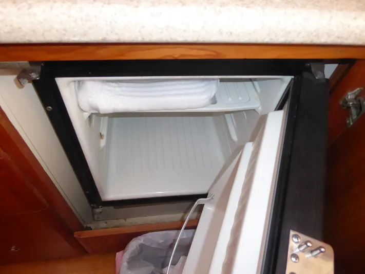 Bee Cee Yacht Photos Pics Open mini fridge in a 2000 Silverton 42C Cummins 450 Diesels boat.