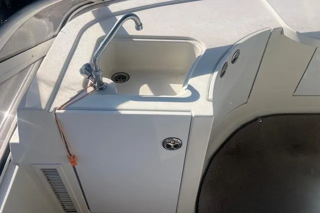  Yacht Photos Pics 2005 Carver 38 Super Sport boat sink area with faucet and storage.