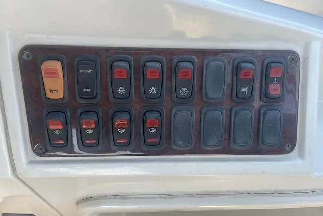  Yacht Photos Pics Control panel of a 2005 Carver 38 Super Sport boat with various switches.