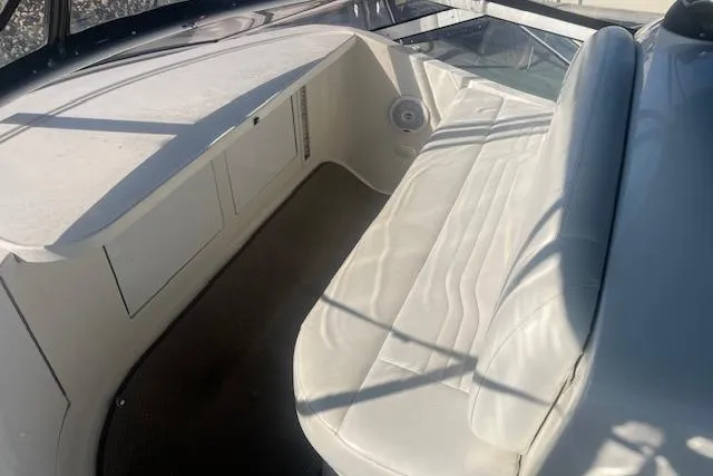  Yacht Photos Pics 2005 Carver 38 Super Sport boat interior with white seating and storage compartments.