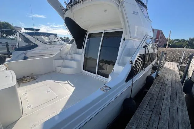  Yacht Photos Pics 2005 Carver 38 Super Sport yacht docked, showcasing spacious deck and sleek design.