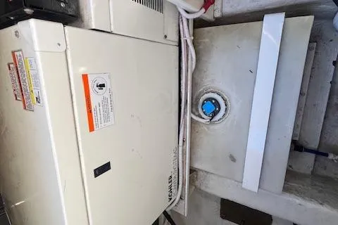  Yacht Photos Pics 2005 Carver 38 Super Sport engine compartment with generator and fuel tank.