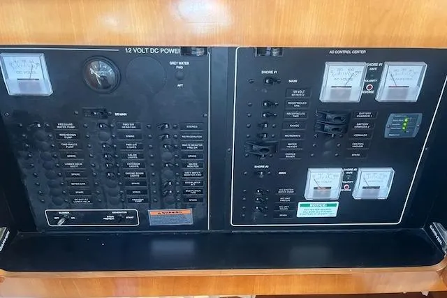  Yacht Photos Pics Electrical control panel of a 2005 Carver 38 Super Sport boat, featuring gauges and switches.