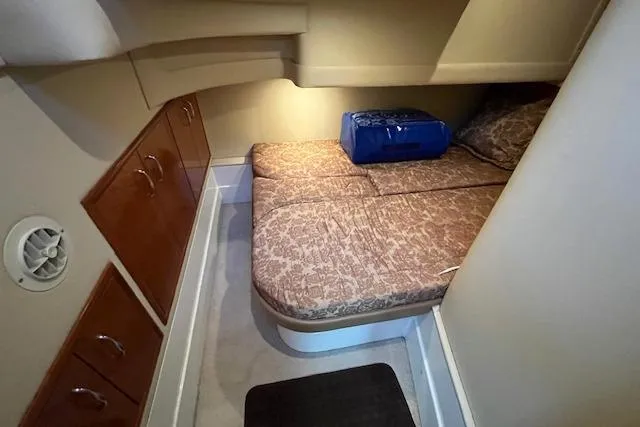  Yacht Photos Pics 2005 Carver 38 Super Sport cabin with bed and storage cabinets.