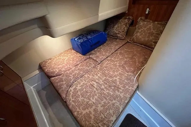  Yacht Photos Pics 2005 Carver 38 Super Sport cabin with patterned bedding and cushions.