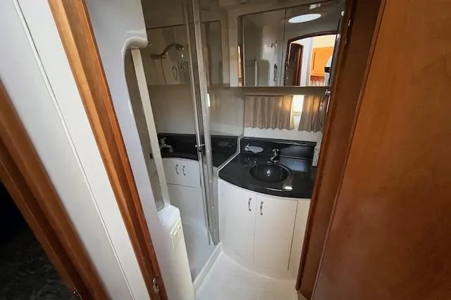  Yacht Photos Pics 2005 Carver 38 Super Sport yacht bathroom with modern fixtures and sleek design.