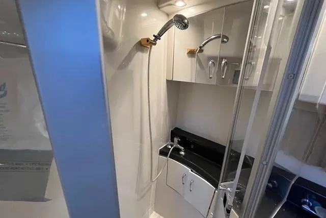  Yacht Photos Pics 2005 Carver 38 Super Sport yacht bathroom with shower and sleek cabinetry.