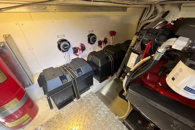  Yacht Photos Pics 2005 Carver 38 Super Sport engine room with batteries and control switches.