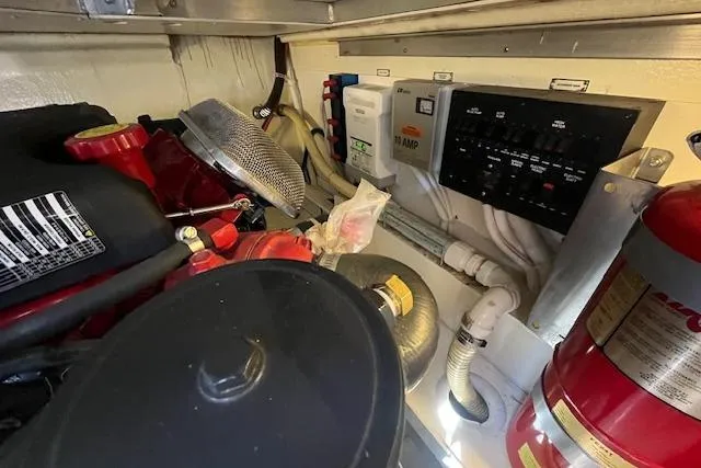  Yacht Photos Pics Engine room of 2005 Carver 38 Super Sport with control panel and fire extinguisher.