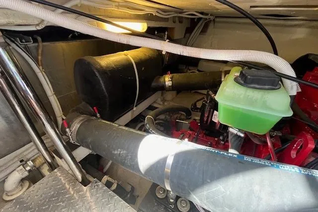  Yacht Photos Pics Engine room of 2005 Carver 38 Super Sport with visible components and piping.