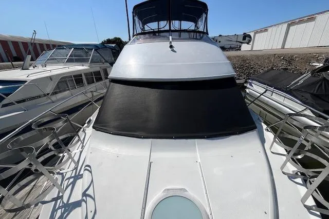  Yacht Photos Pics 2005 Carver 38 Super Sport yacht docked at marina, front view.