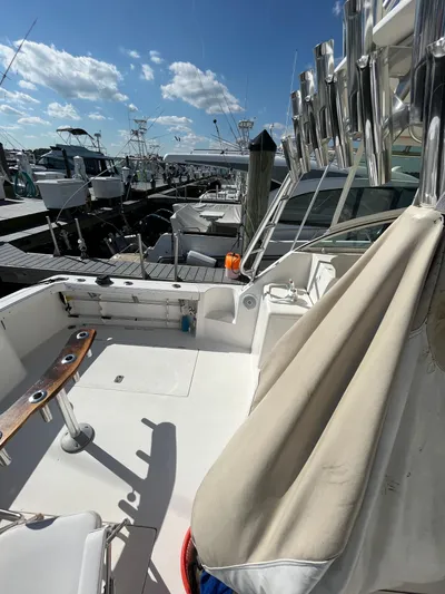  Yacht Photos Pics 2007 Henriques 35 Open boat docked at marina under blue sky.
